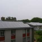 The solar water heating system at the Onderstepoort campus of the University of Pretoria includes 336 solar collectors installed on the roofs of campus carports and other buildings.
