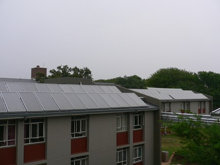 The solar water heating system at the Onderstepoort campus of the University of Pretoria includes 336 solar collectors installed on the roofs of campus carports and other buildings.