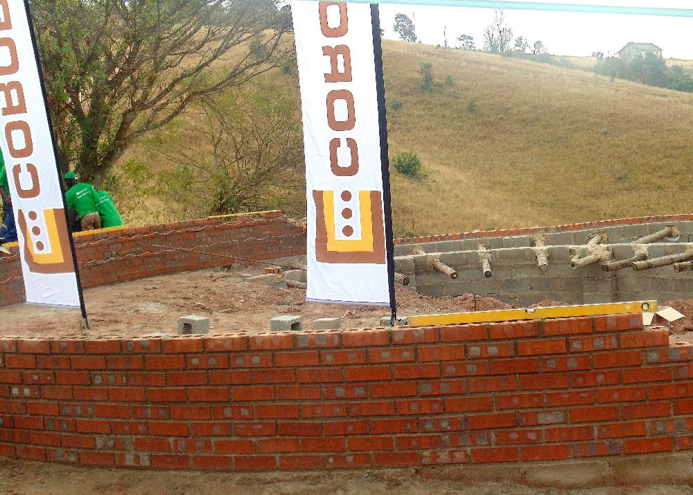 A rondavel under construction using clay bricks from Corobrik