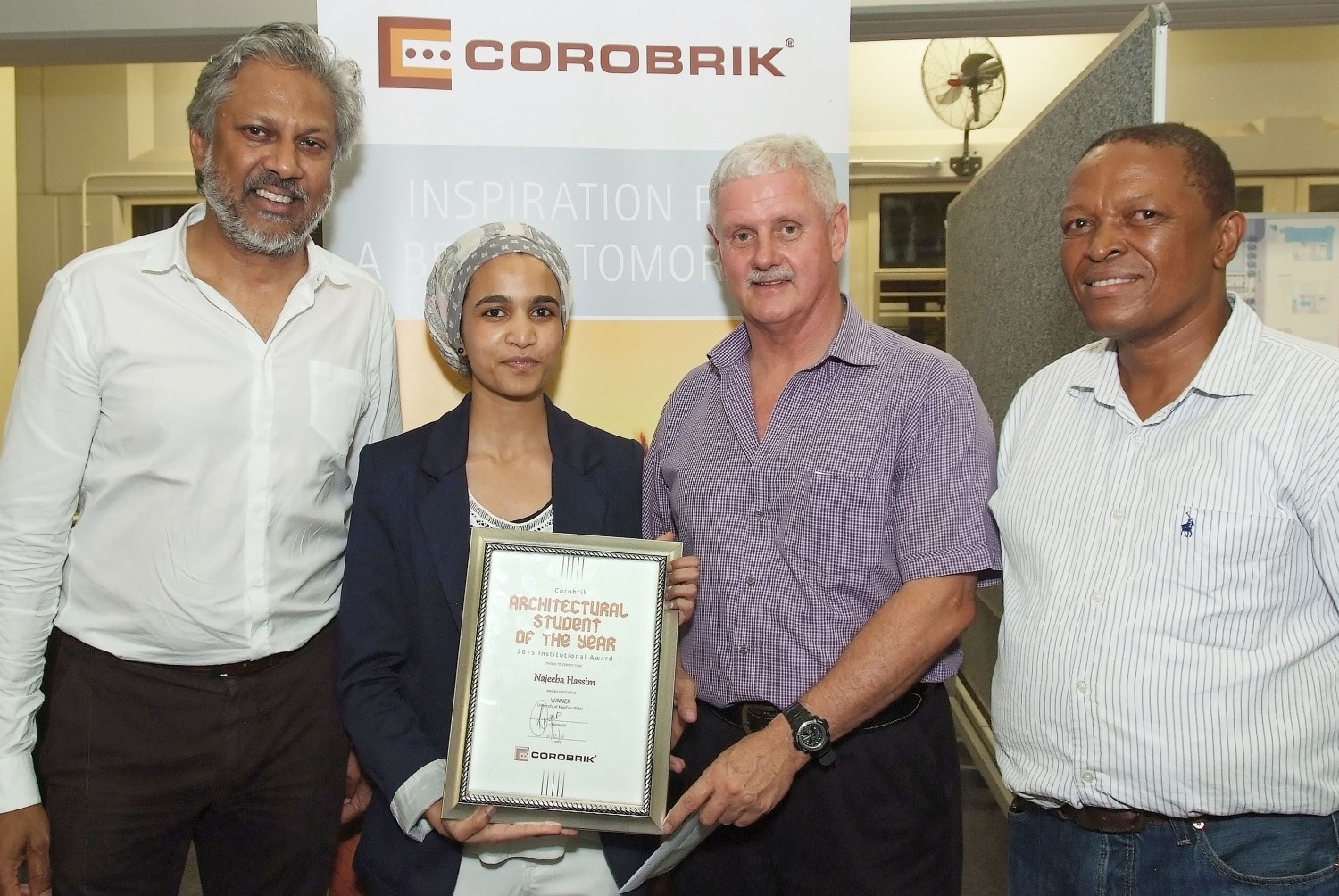 From left: Ruben Reddy President of the KZN Institute for Architects, the winner Najeeba Hassim, Allin Dangers, Corobrik Director of Sales – Coastal and Mthembeni Mkhize, Head of the Dept. of Architecture at UKZN.