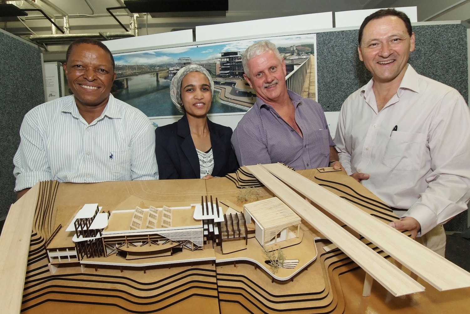 Najeeba Hassim received her award for winning the regional finals from Allin Dangers.  Also pictured are (left) Mthembeni Mkhize, Head of the Dept. of Architecture and (right) Juan Solis from the University.