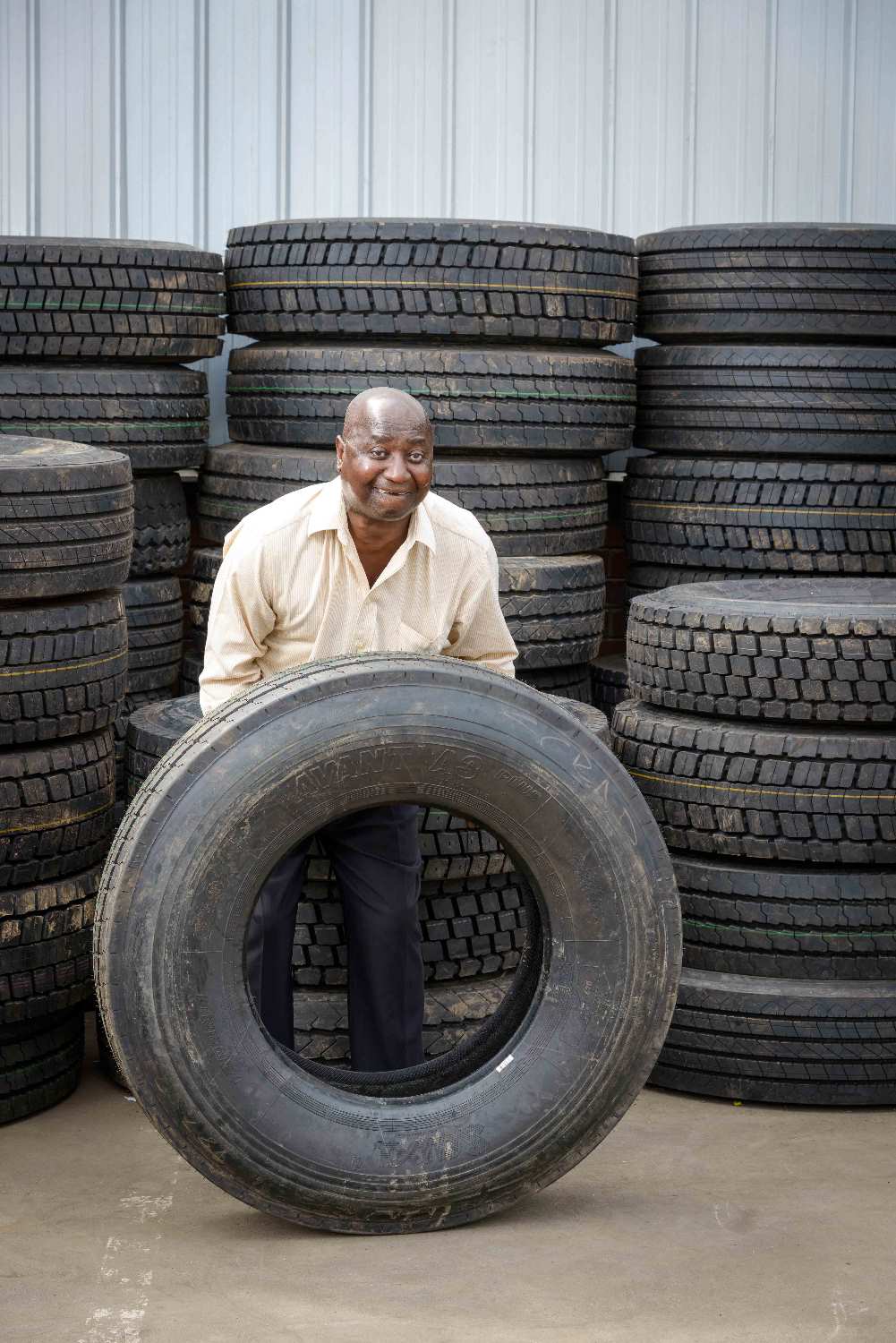Mr Vusumuzi Mathe with one of the truck tyres