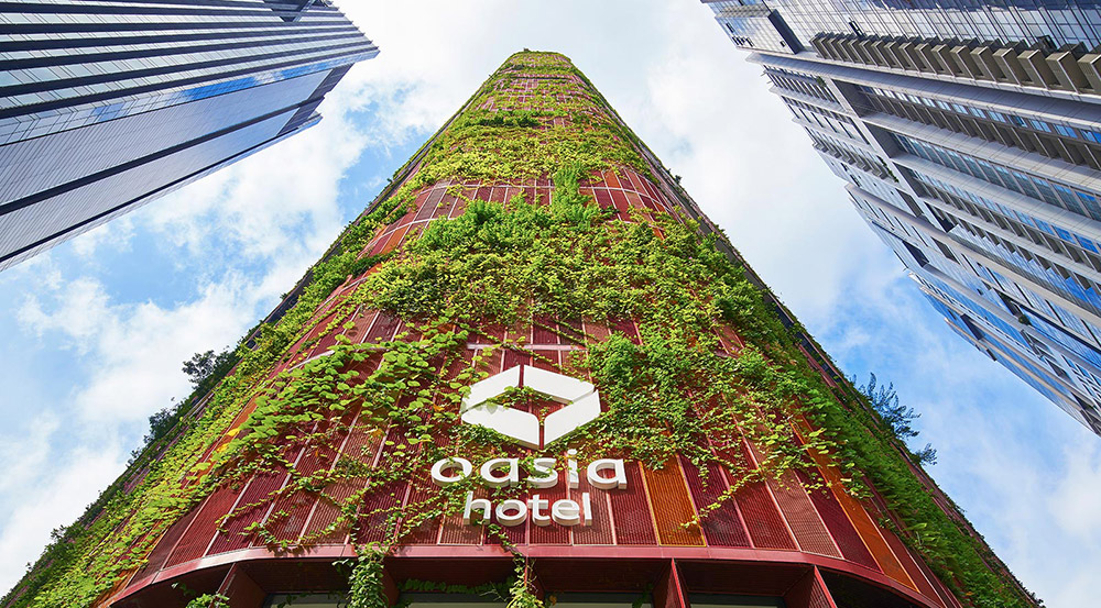 Oasia Hotel, environmentally friendly skyscraper in Singapore with indigenous vegetation growing on the facades
