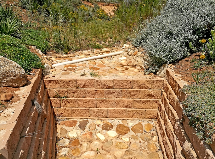 stone and concrete retaining walls and stairs