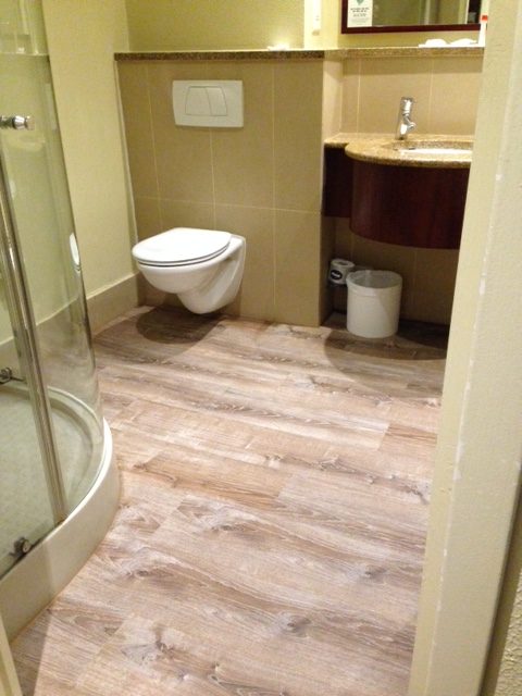city lodge bathroom flooring Smoked Oak Traviloc luxury vinyl tiles