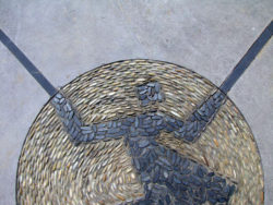 screedcrete exterior paving art with stones and pebbles